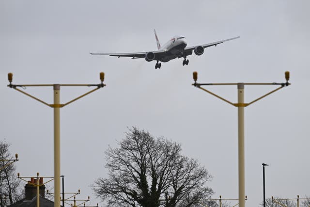 <p>A British Airways passenger plane struggles with the high winds on approach to Heathrow Airport.</p>