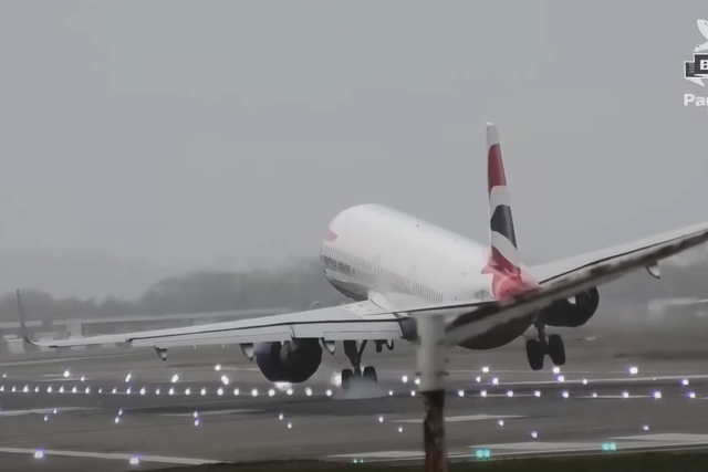 <p>A British Airways aircraft lands at Heathrow amid high winds due to Storm Eunice</p>