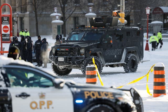 <p>Police stand guard in the capital as protesters are arrested </p>