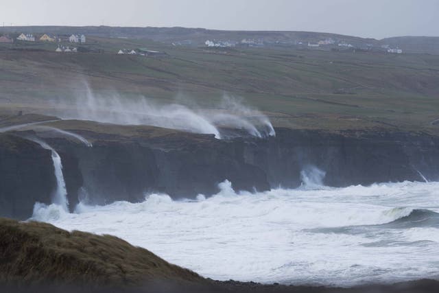 Water is blown on to the land by fierce winds near Doolin, Co Clare (Eamon Ward/PA)