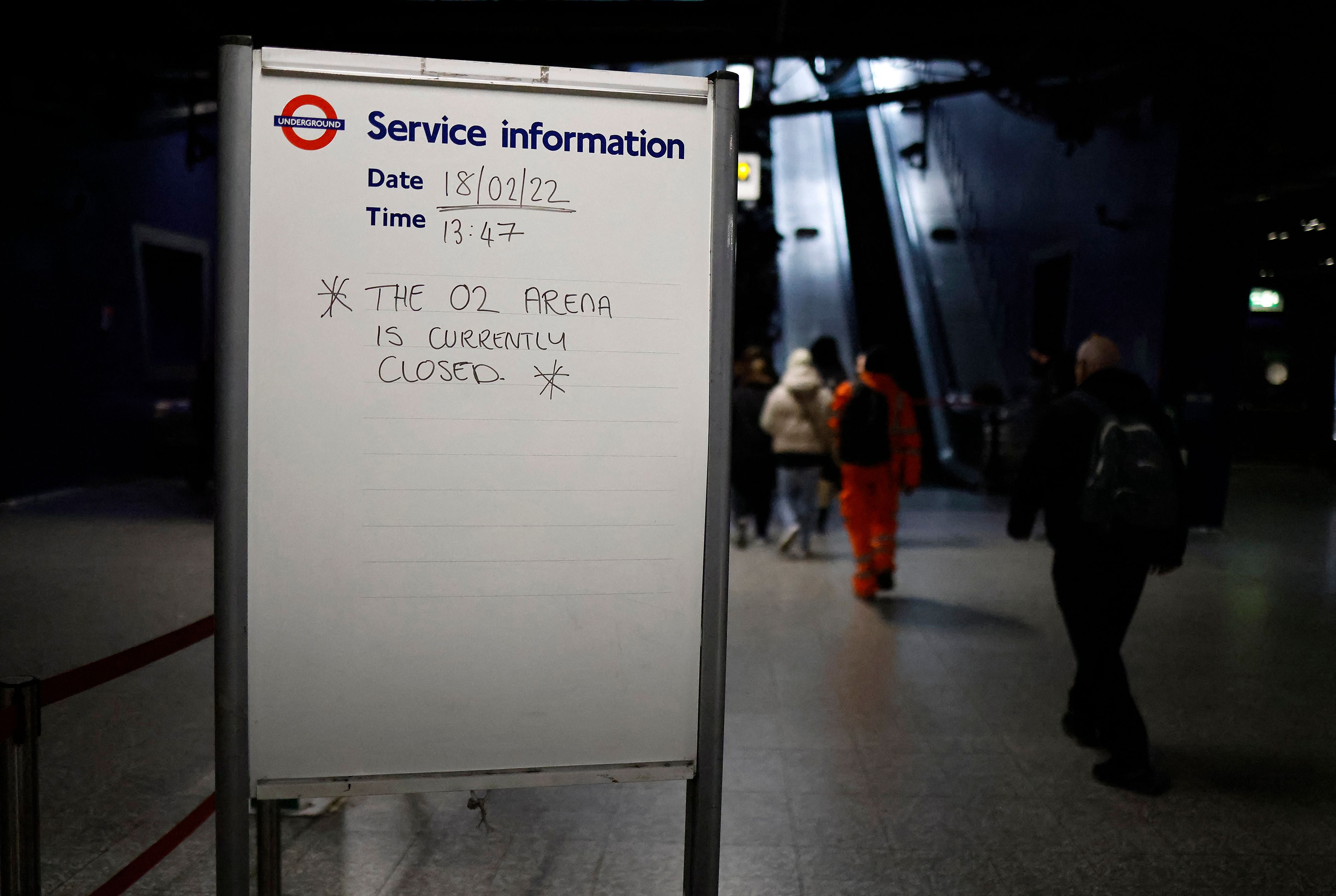 A sign at North Greenwich underground station reads 'The O2 Arena is currently closed'