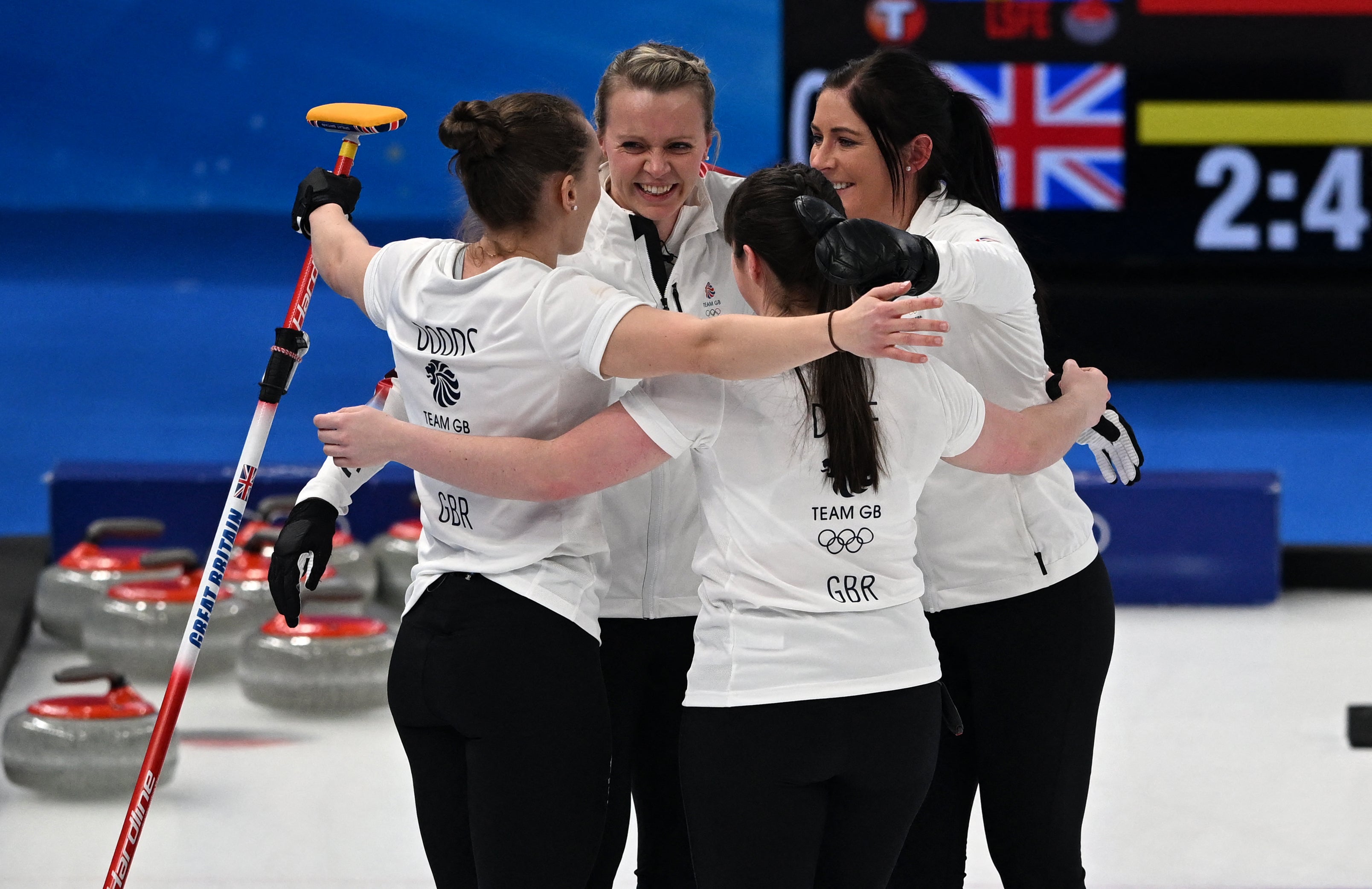 Eve Muirhead and Team GB celebrate their dramatic victory on an extra end