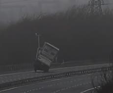 Storm Eunice: Huge lorry topples over on motorway in dramatic footage of 100mph gales