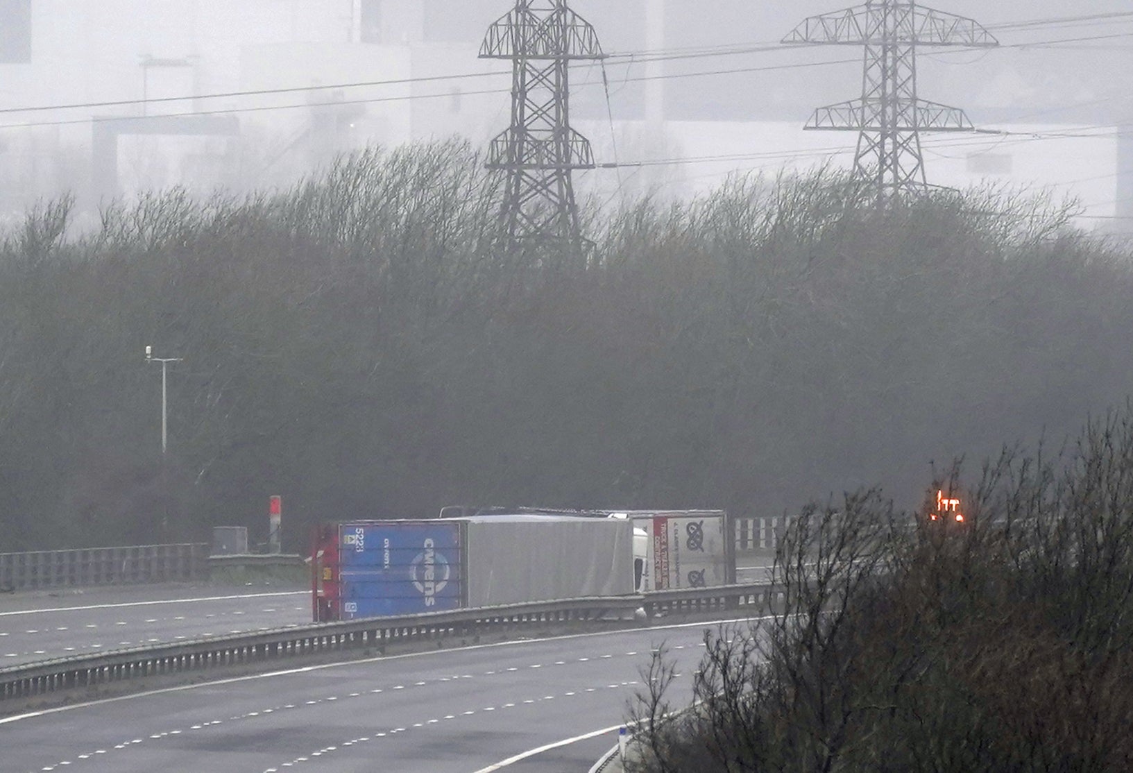 Two lorries blown on their sides on M4 in Margam, south Wales