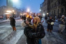 AP PHOTOS: Huddling around fires, dancing at Ottawa protest