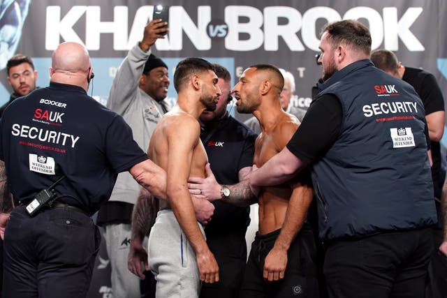 <p>Amir Khan, left, and Kell Brook fight at the AO Arena in Manchester on Saturday night (Nick Potts/PA)</p>
