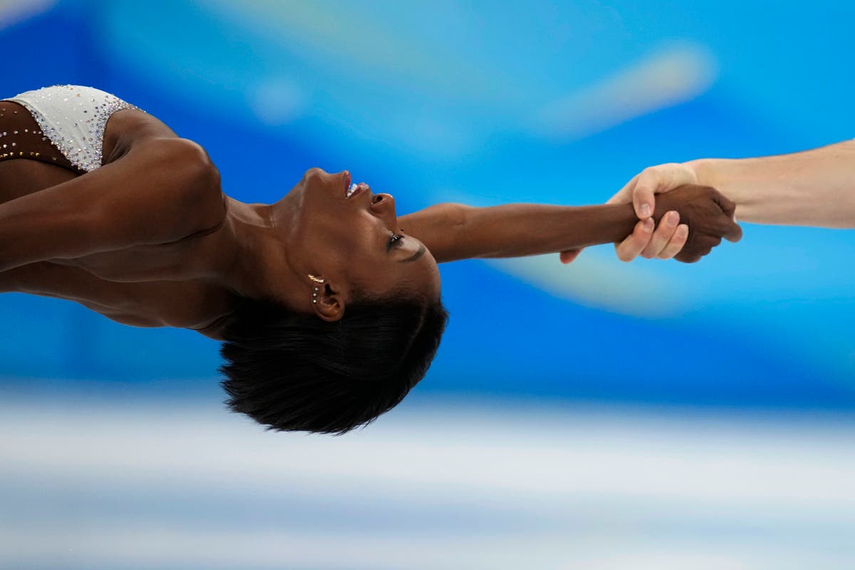AP PHOTOS: Gu among winners on day 14 of the Winter Olympics