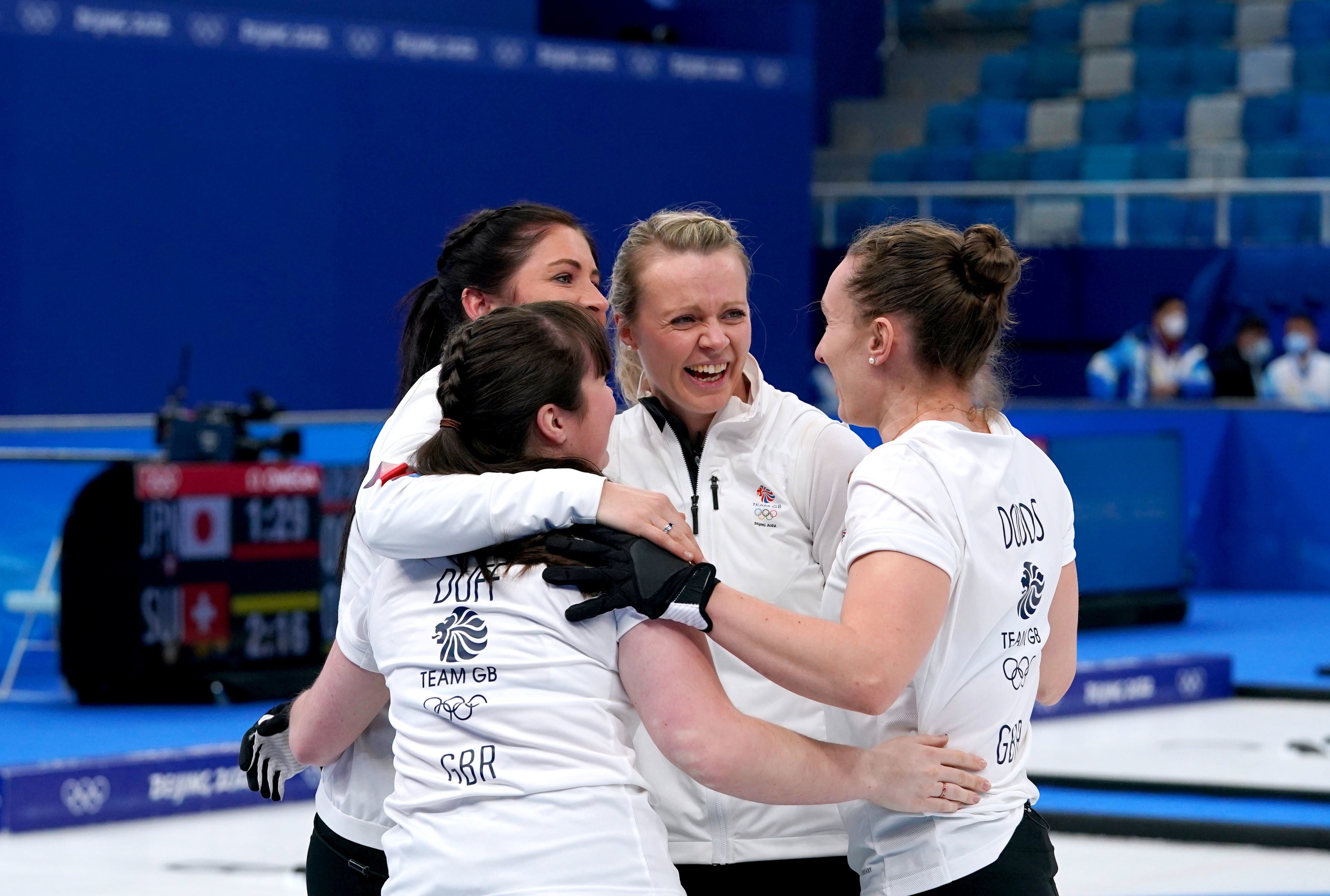Vicky Wright, centre, celebrates with teammates after the semi-final