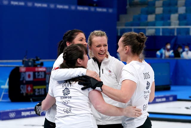 <p>Vicky Wright, centre, celebrates with teammates after the semi-final</p>