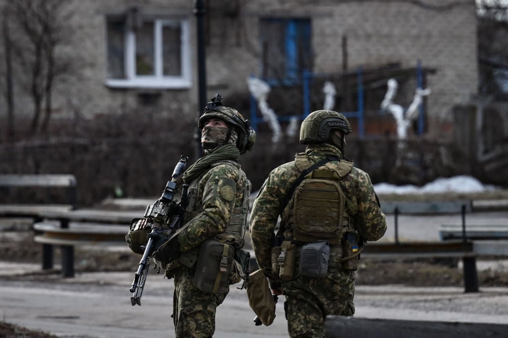 Ukrainian troops patrol in the town of Novoluhanske, eastern Ukraine, on 19 February