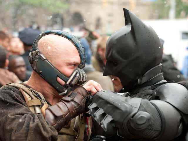 <p>Batman and Bane in ‘The Dark Knight Rises'</p>