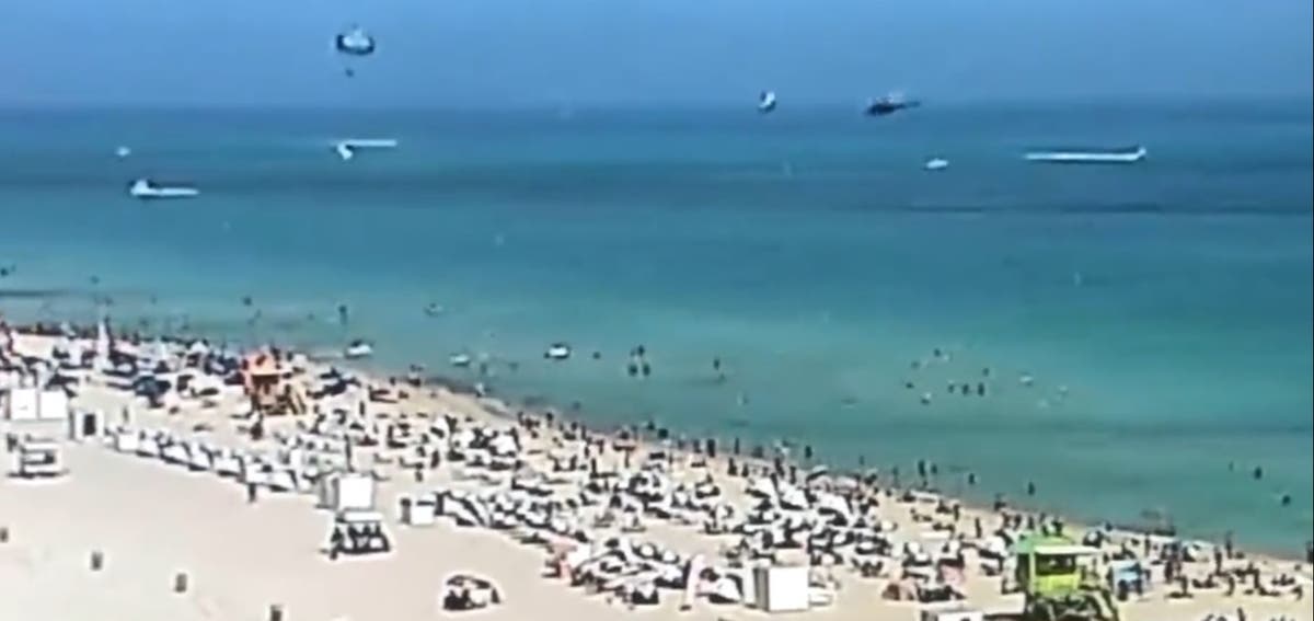 &lsquo;A helicopter just crashed in front of us&rsquo;: Video shows chopper plunging into water near crowded Miami beach