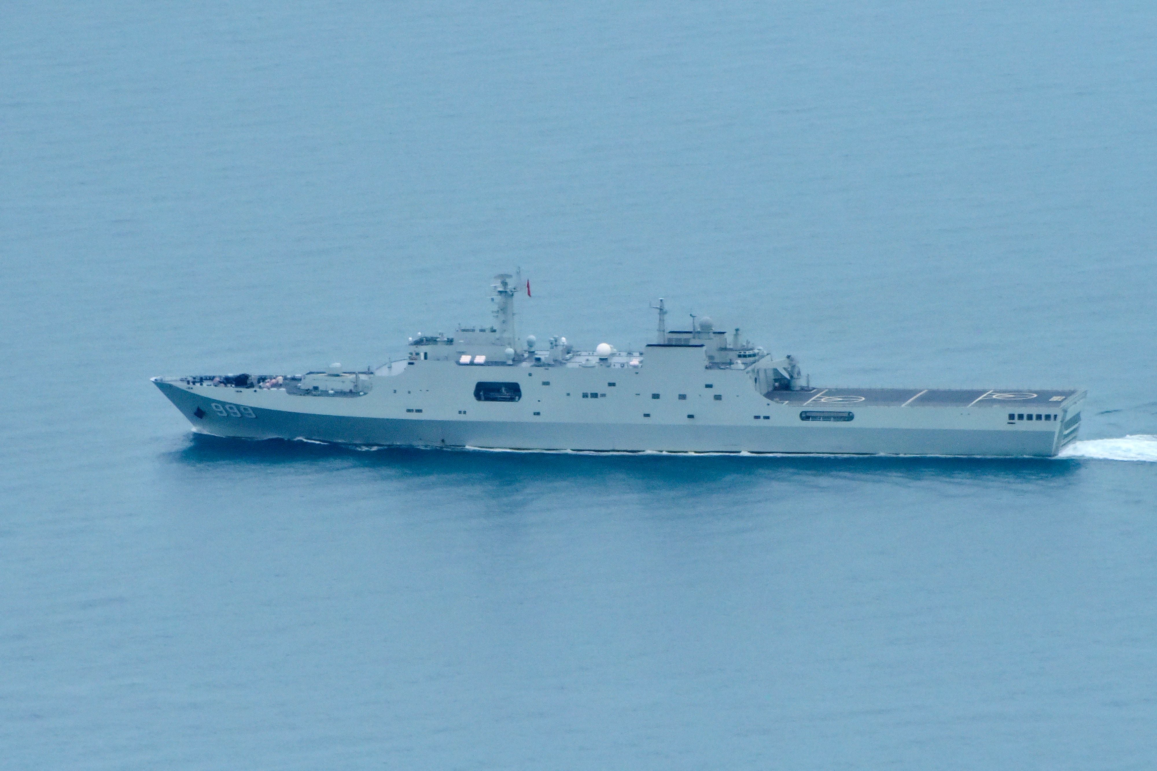 A handout photo taken on 18 February 2022 and received on 20 February shows a Chinese PLA-N Yuzhao-class amphibious transport dock vessel transiting the Torres Strait in northern Australia after the Australian Defence Force confirmed that on 17 February, a royal Australian air force (RAAF) P-8A Poseidon detected a laser illuminating the aircraft