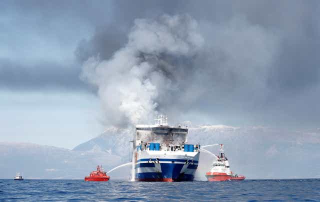 <p>Smoke rises from the Euroferry Olympia which sailed from Greece to Italy and caught fire off the coast of Corfu</p>