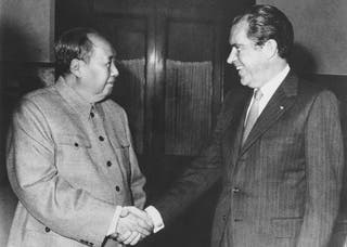 Then Chinese communist party leader Mao Zedong, left, and then US president Richard Nixon shake hands as they meet in Beijing on Feb. 21, 1972.