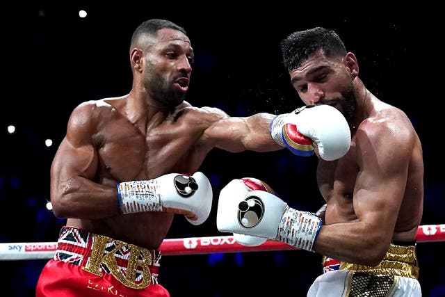 <p>Kell Brook (left) in action against Amir Khan at Manchester’s AO Arena (Nick Potts/PA)</p>