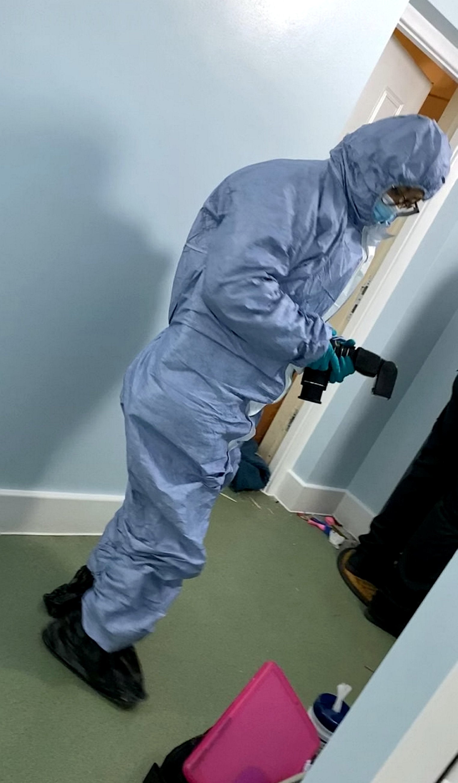 A forensic officer attending the property