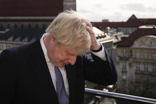 Prime Minister Boris Johnson rubbing his hair to get ready for a interview during the Munich Security Conference in Germany where he is meeting with world leaders to discuss tensions in eastern Europe. Picture date: Saturday February 19, 2022.