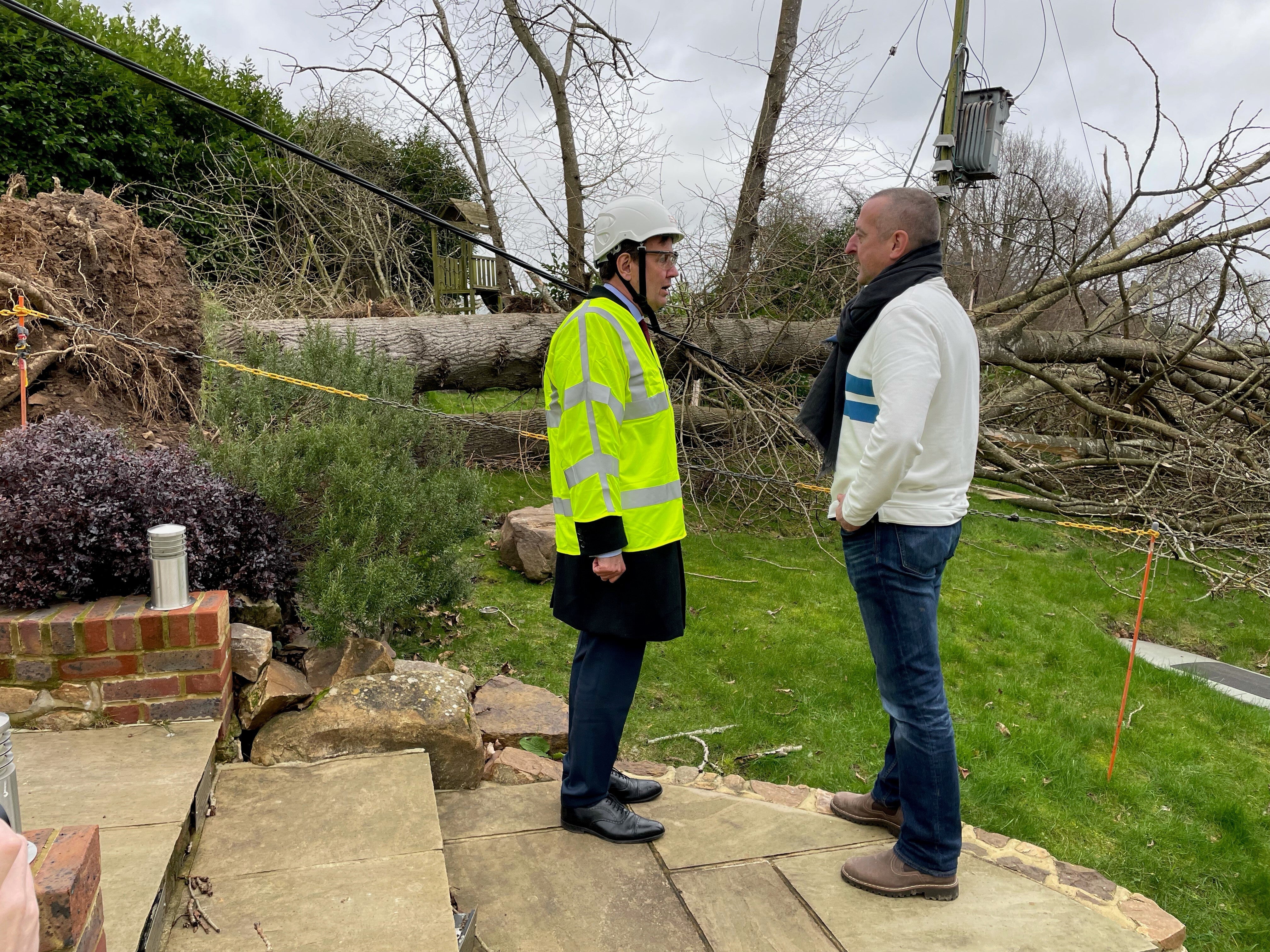 David Thomas (right), a resident of Oldbury, Ightham in Kent, with Energy minister Greg Hands after his home got cut off from the power grid (Sophie Wingate/PA)
