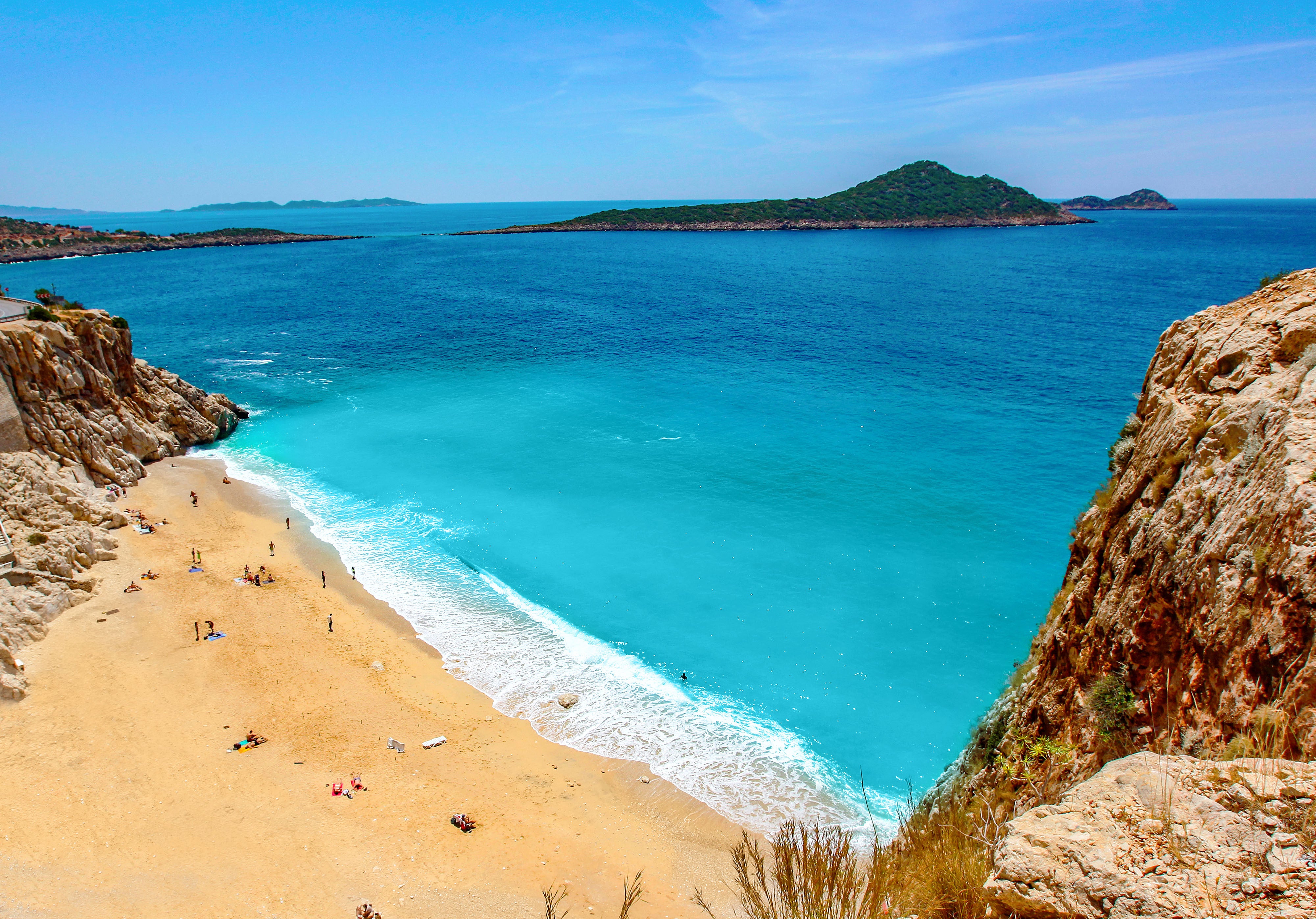 Flanked by crags, the golden sands and crystalline waters of Kaputaş Beach are a must-experience