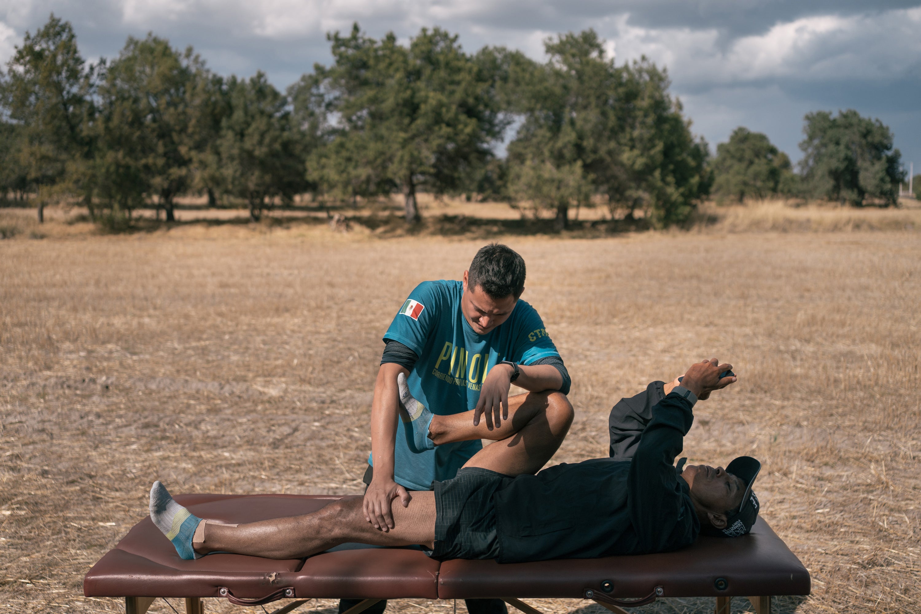 Physiotherapist Luis Francisco Corona Jaramillo stretches Silva during a break in Tlaxcala