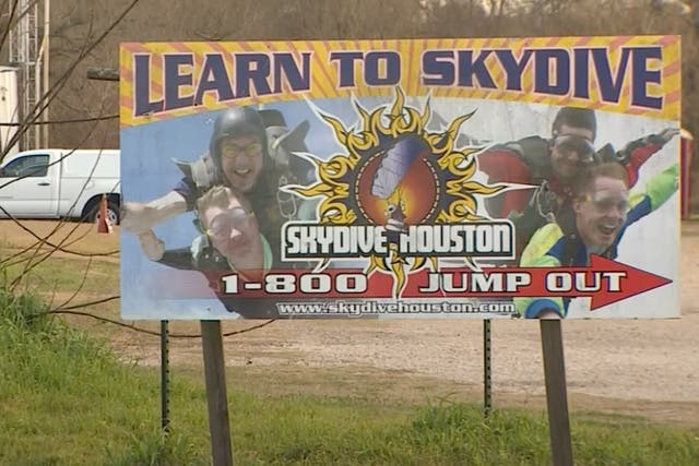 <p>A billboard for “Skydive Houston,” which offers tandem skydiving lessons. One of the instructors at the school died during a tandem jump in February after an accident involving his parachute malfunctioned. </p>