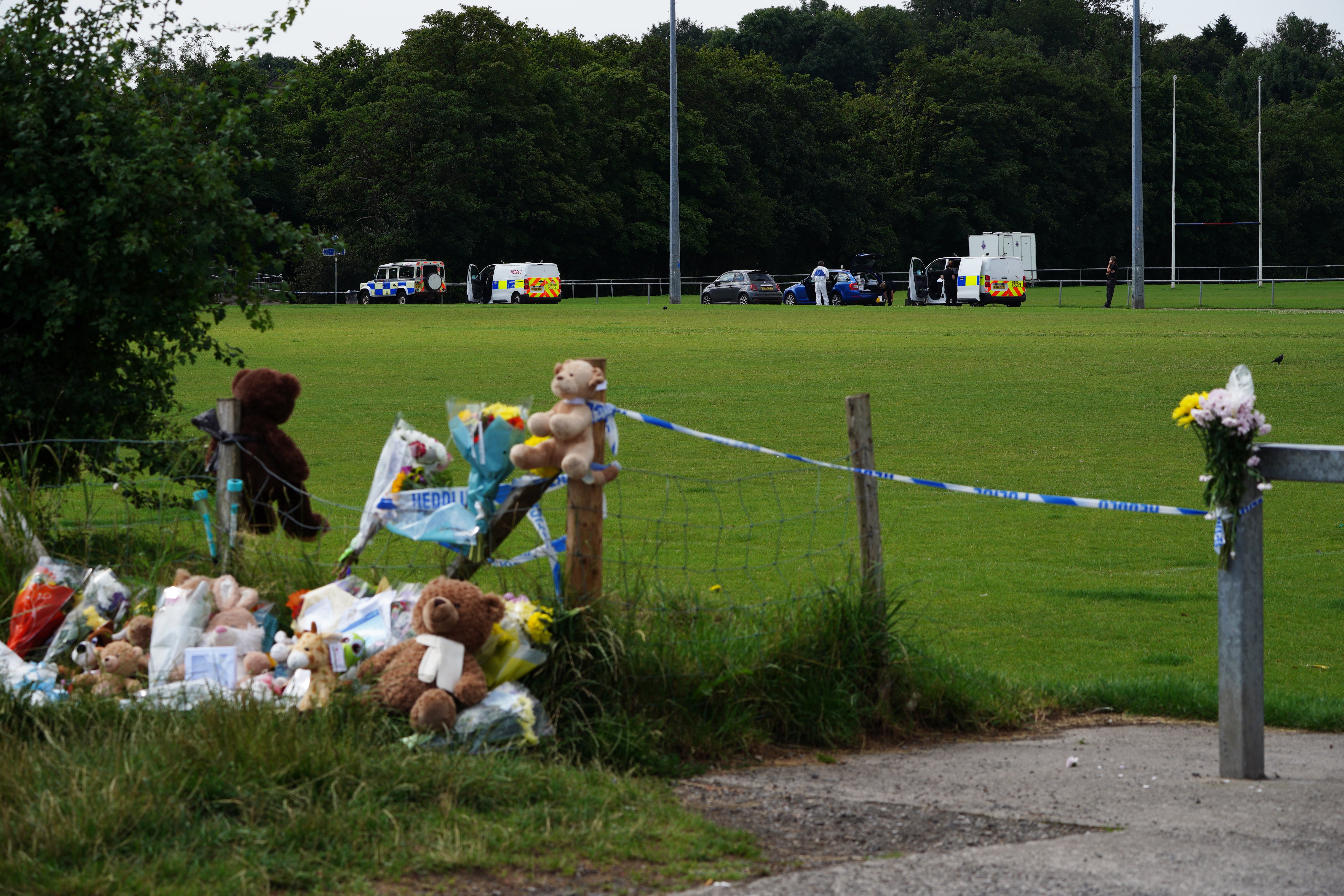 Tributes left at the scene in the Sarn area of Bridgend, south Wales, near to where five-year-old Logan Mwangi was found dead in the Ogmore River