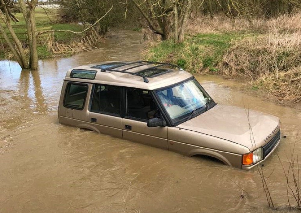 A family with a baby were saved after their 4×4 became stranded in floodwater in East Leake (Nottinghamshire Fire and Rescue Service/PA)