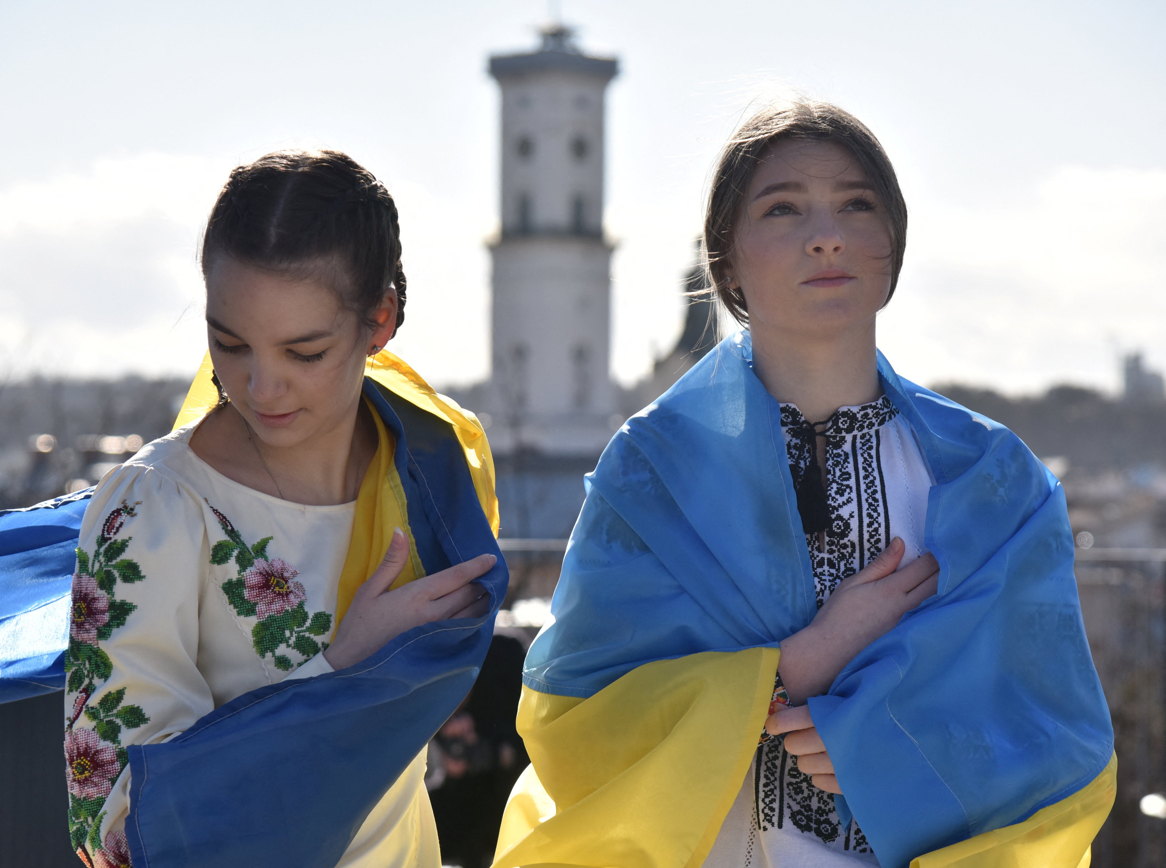 <p>Demonstrators wear the Ukraine national flag during ‘Unity March’ in Lviv </p>