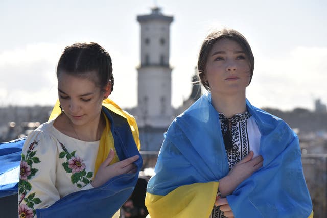 <p>Demonstrators wear the Ukraine national flag during ‘Unity March’ in Lviv </p>