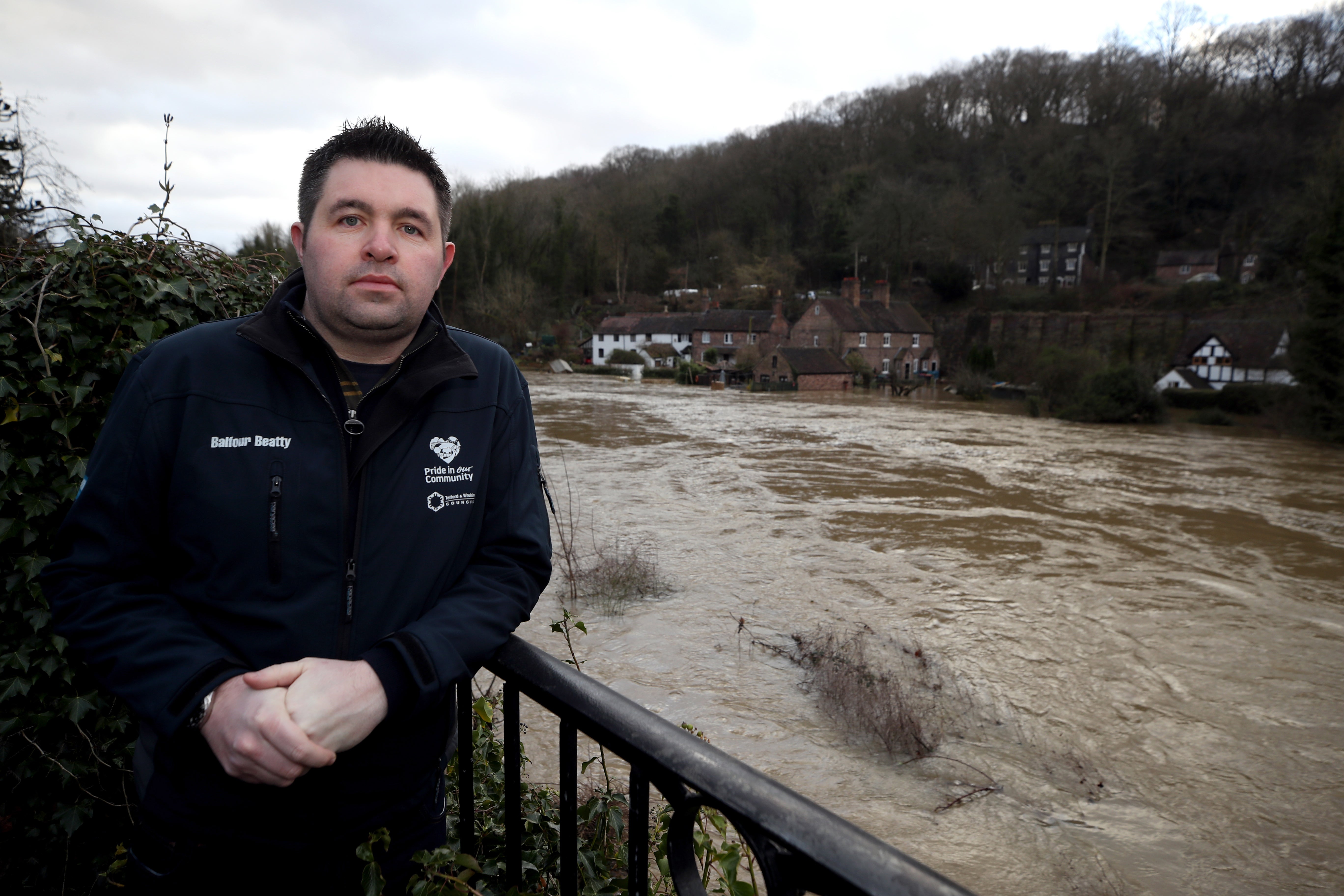 Telford and Wrekin councillor Shaun Davies near the River Severn following high winds and wet weather in Ironbridge, Shropshire