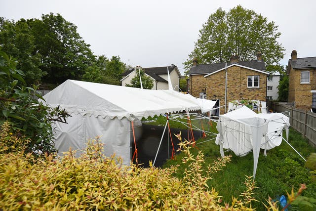 A tent in the garden of a house in Consort Road, Peckham, southeast London, which is being guarded by police officers investigating the shooting of black equal rights activist and mother-of-three Sasha Johnson (Kirsty O’Connor/PA)