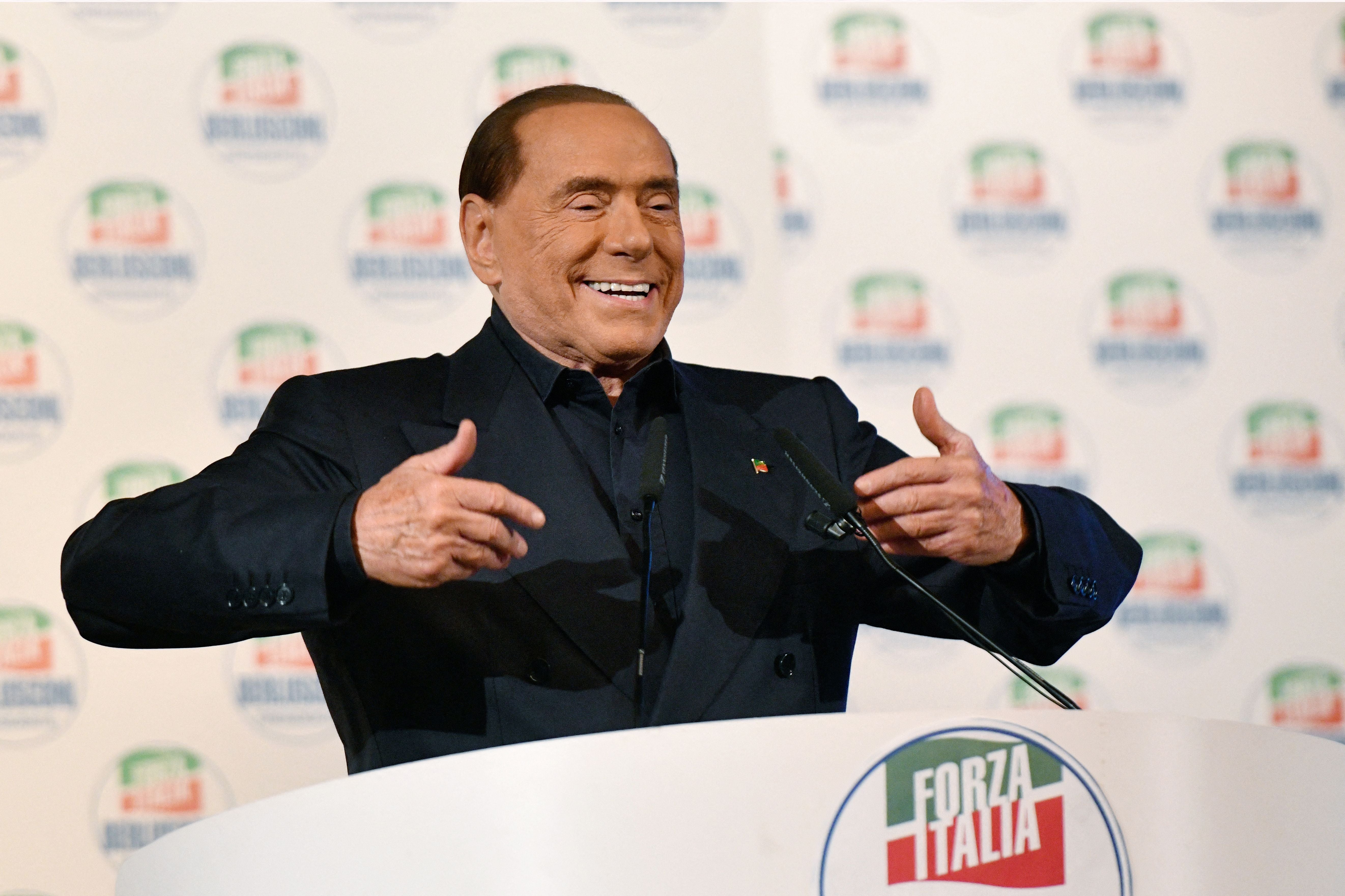 Silvio Berlusconi delivers a speech on stage during a campaign rally in Milan in 2018