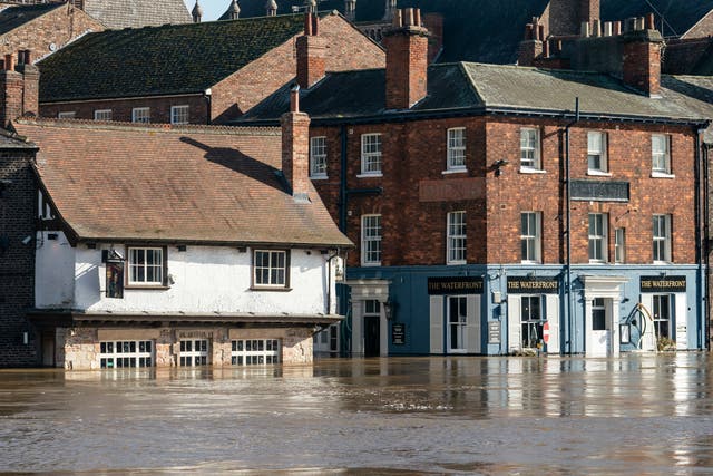 <p>Flood water in York on Tuesday after the River Ouse overtopped its banks</p>