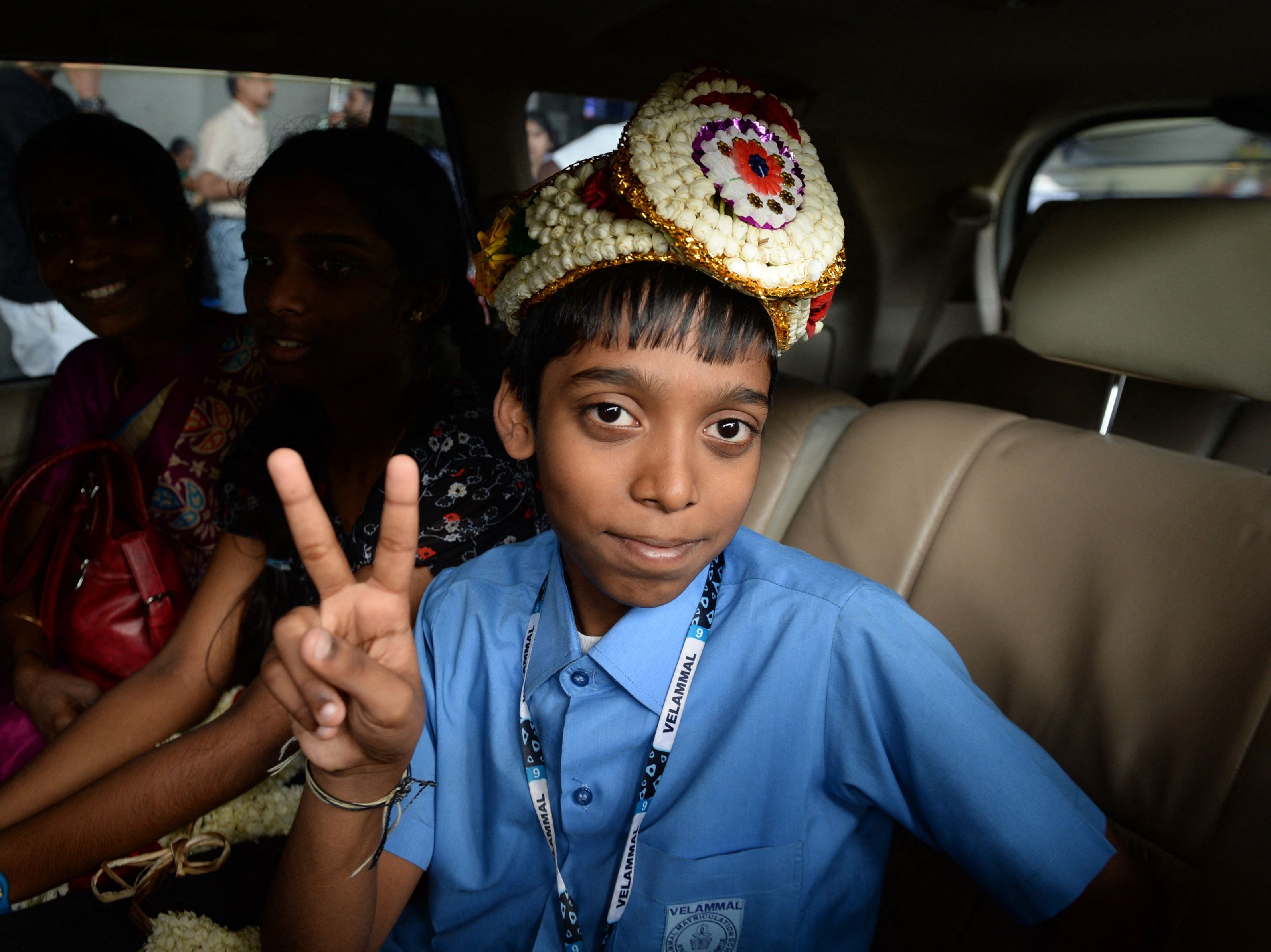 Indian chess prodigy Rameshbabu Praggnanandhaa, poses for a photograph on his arrival at an airport in Chennai