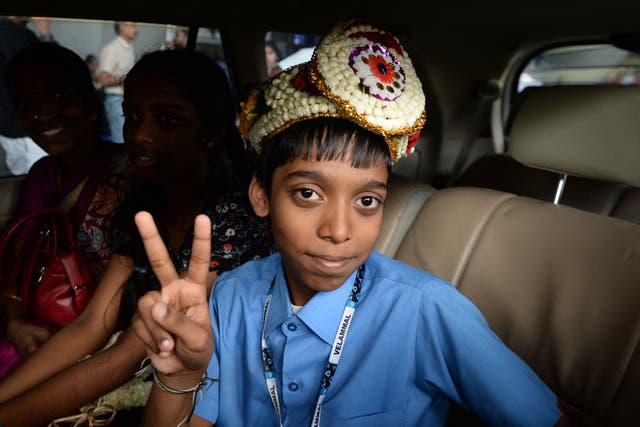 <p>Indian chess prodigy Rameshbabu Praggnanandhaa, poses for a photograph on his arrival at an airport in Chennai</p>