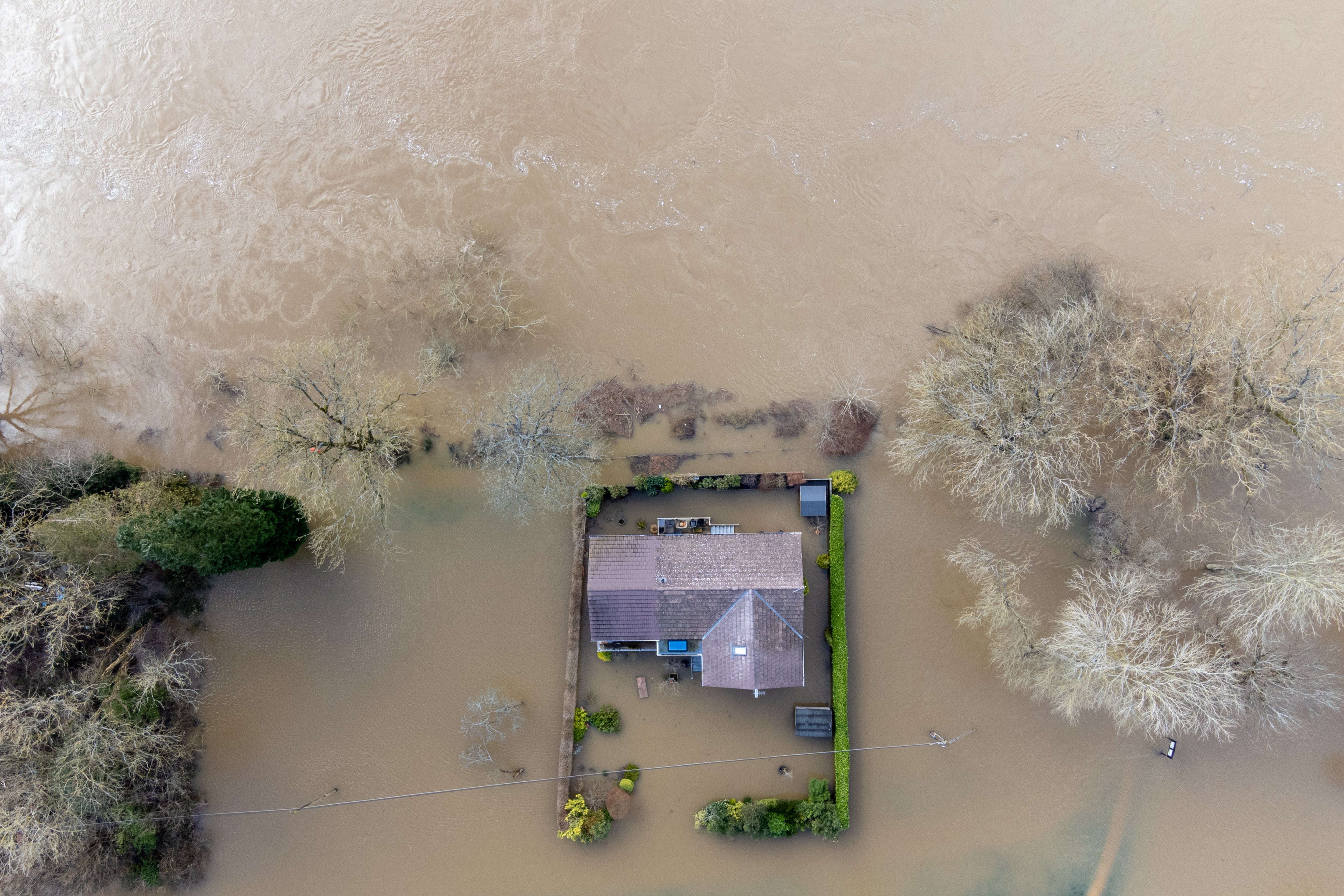 A property surrounded by flood water after the River Severn burst its banks