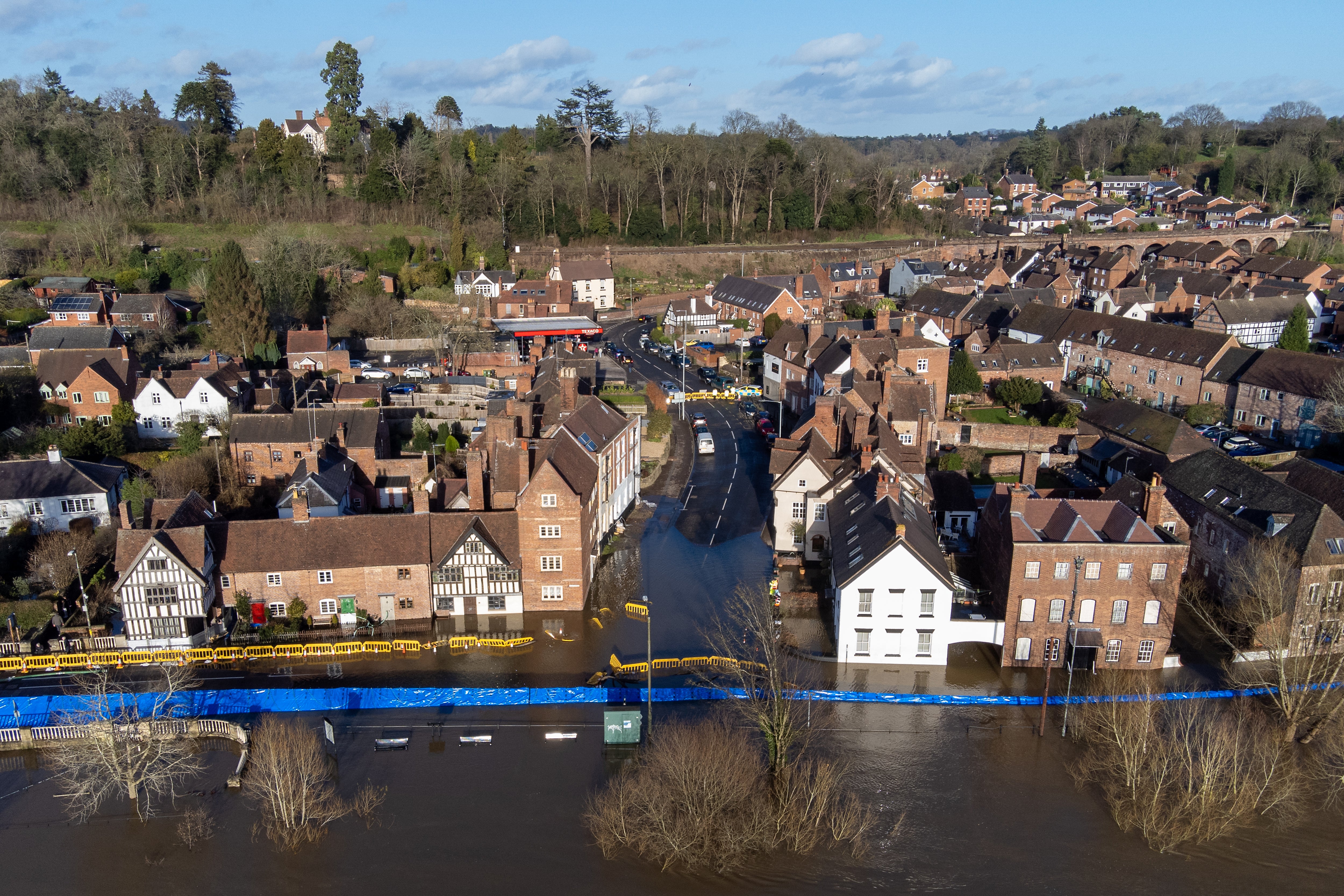 Water begins to spill behind flood defences along the River Severn at Bewdley