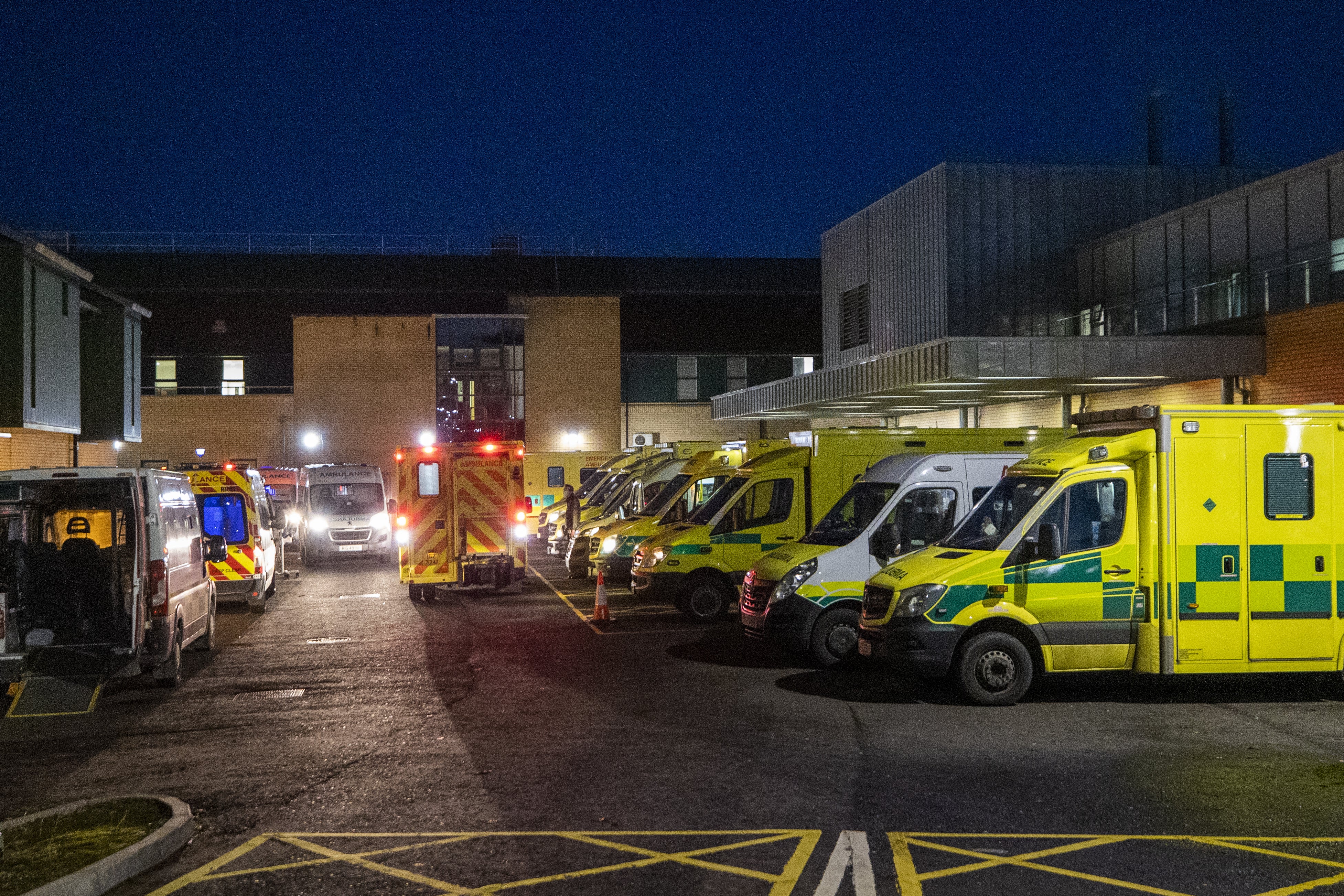 Ambulances at the entrance to the emergency department with a number of the vehicle with patients awaiting to be admitted, at Antrim Area Hospital, Co Antrim during a previous period of high pressure (Liam McBurney/PA)