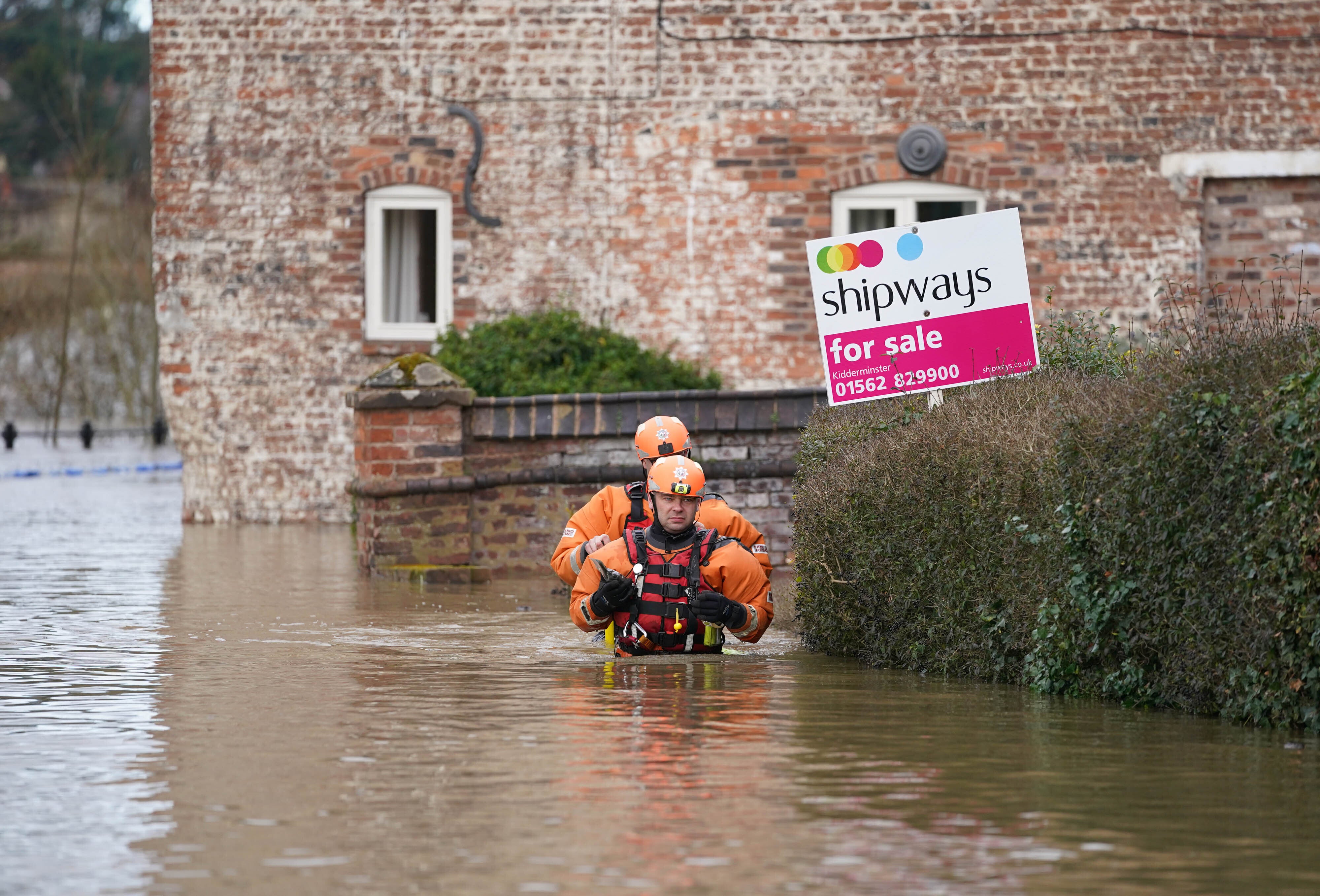 A fire and rescue team in floodwater in Bewdley (Joe Giddens/PA)