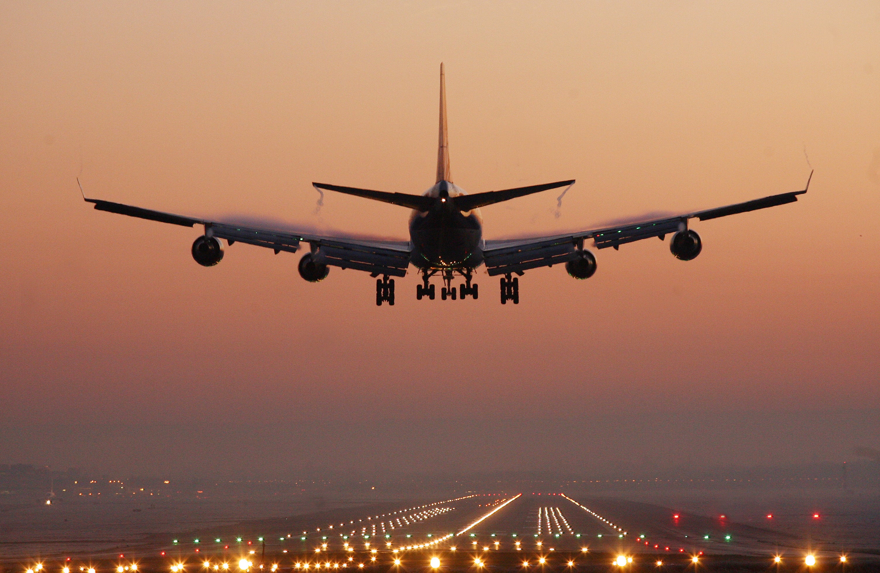 An early morning passenger jet prepares to land (Gareth Fuller/PA)