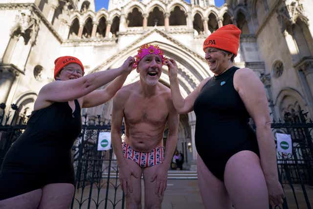 Swimmers from Hampstead Ponds outside the Royal Courts of Justice (Victoria Jones/PA)