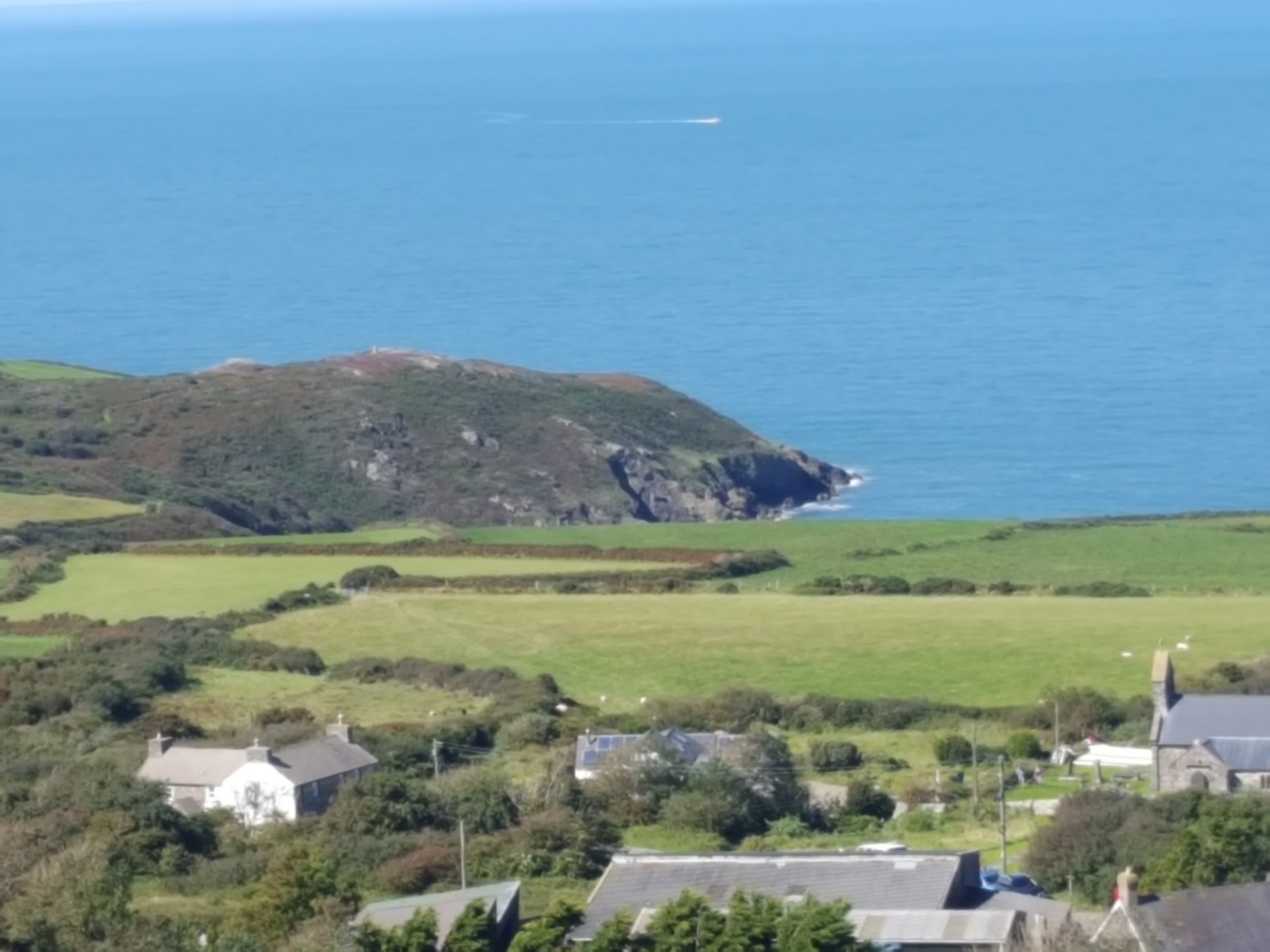 Llanwnda village looking towards the memorial stone on the cliff above the landing site