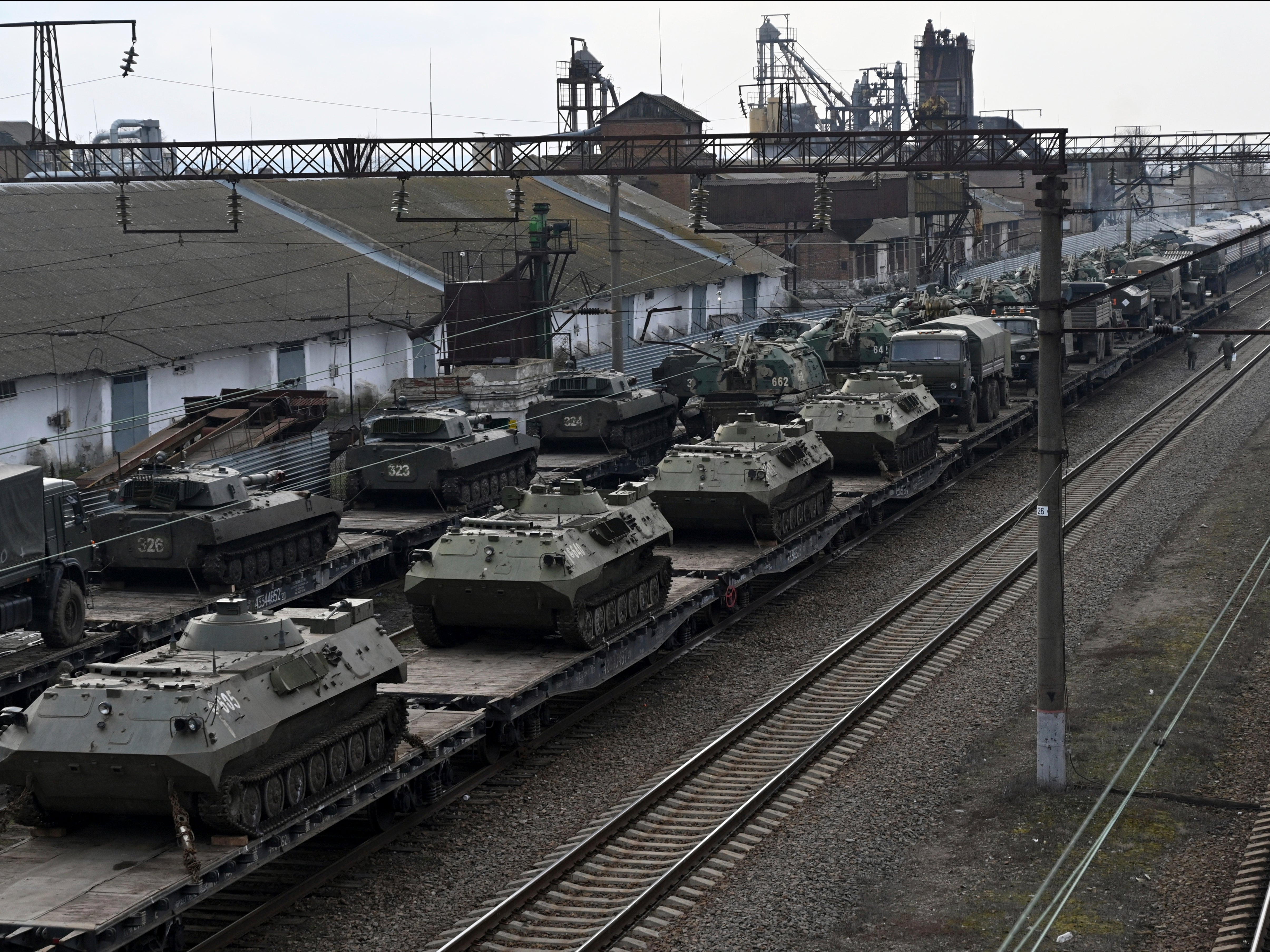Russian armored vehicles are loaded onto railway platforms in the Rostov-on-Don region
