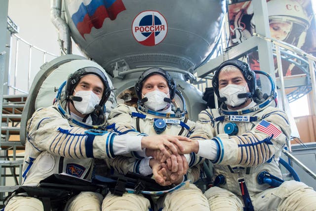 <p>Russian cosmonauts and a US astronaut pose for a photo before departing for the International Space Station on 20 March, 2021</p>