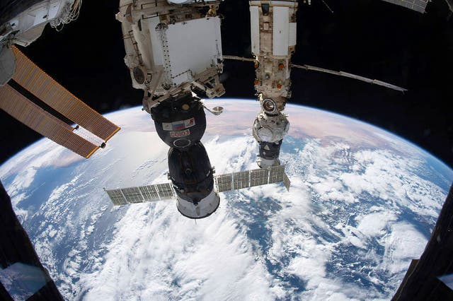 <p>A Russian Soyuz spacecraft docked with the Russian segment of the International Space Station in December 2021</p>