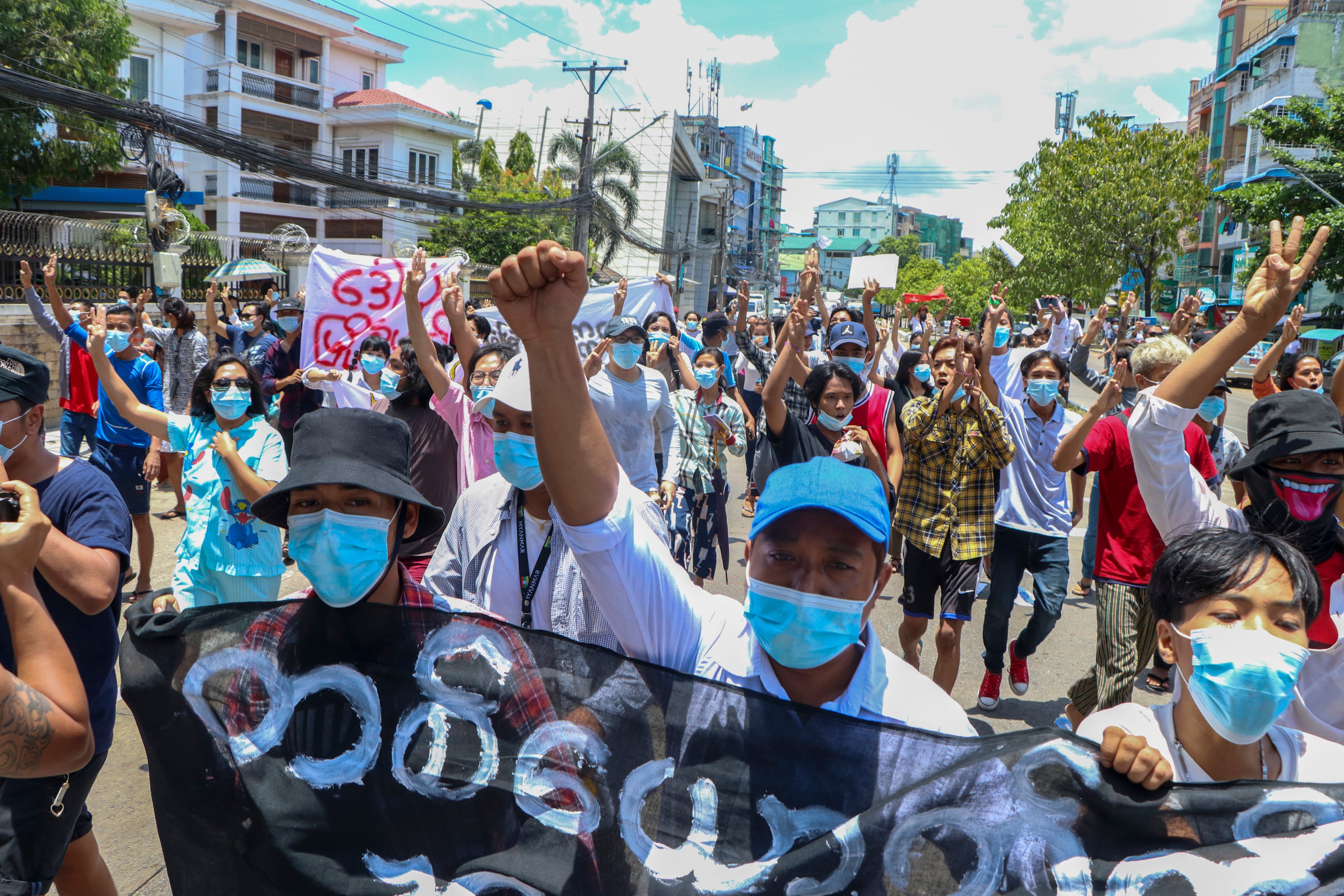 File: Anti-coup protesters march during a demonstration in Yangon, Myanmar on 12 May 2021