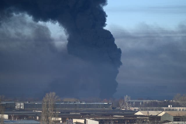 <p>Black smoke rises from a military airport in Chuguyev near Kharkiv  on 24 February 2022</p>
