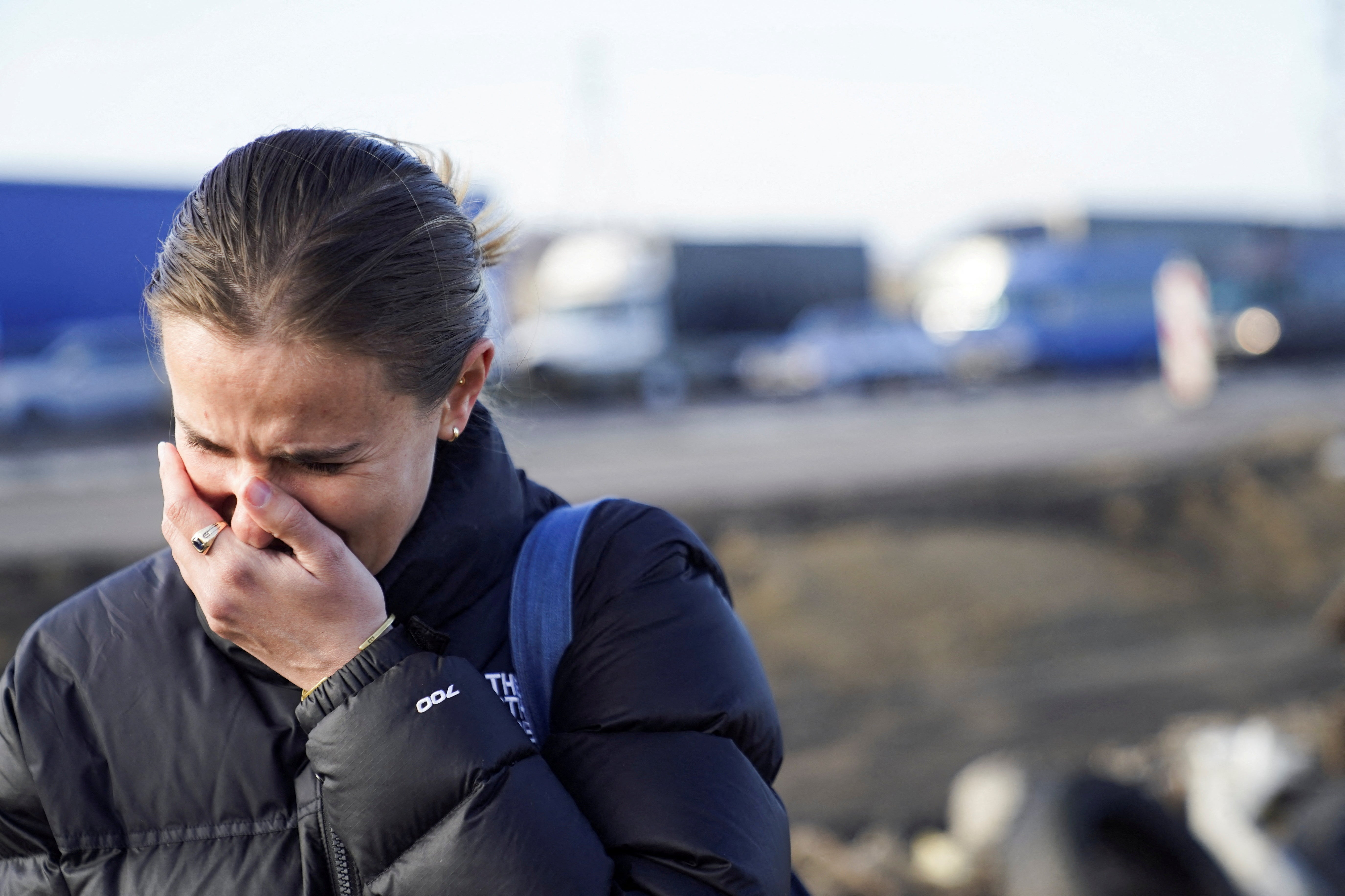 A woman cries after crossing the border and fleeing the violence in Ukraine, in Medyka, Poland, 24 February 2022