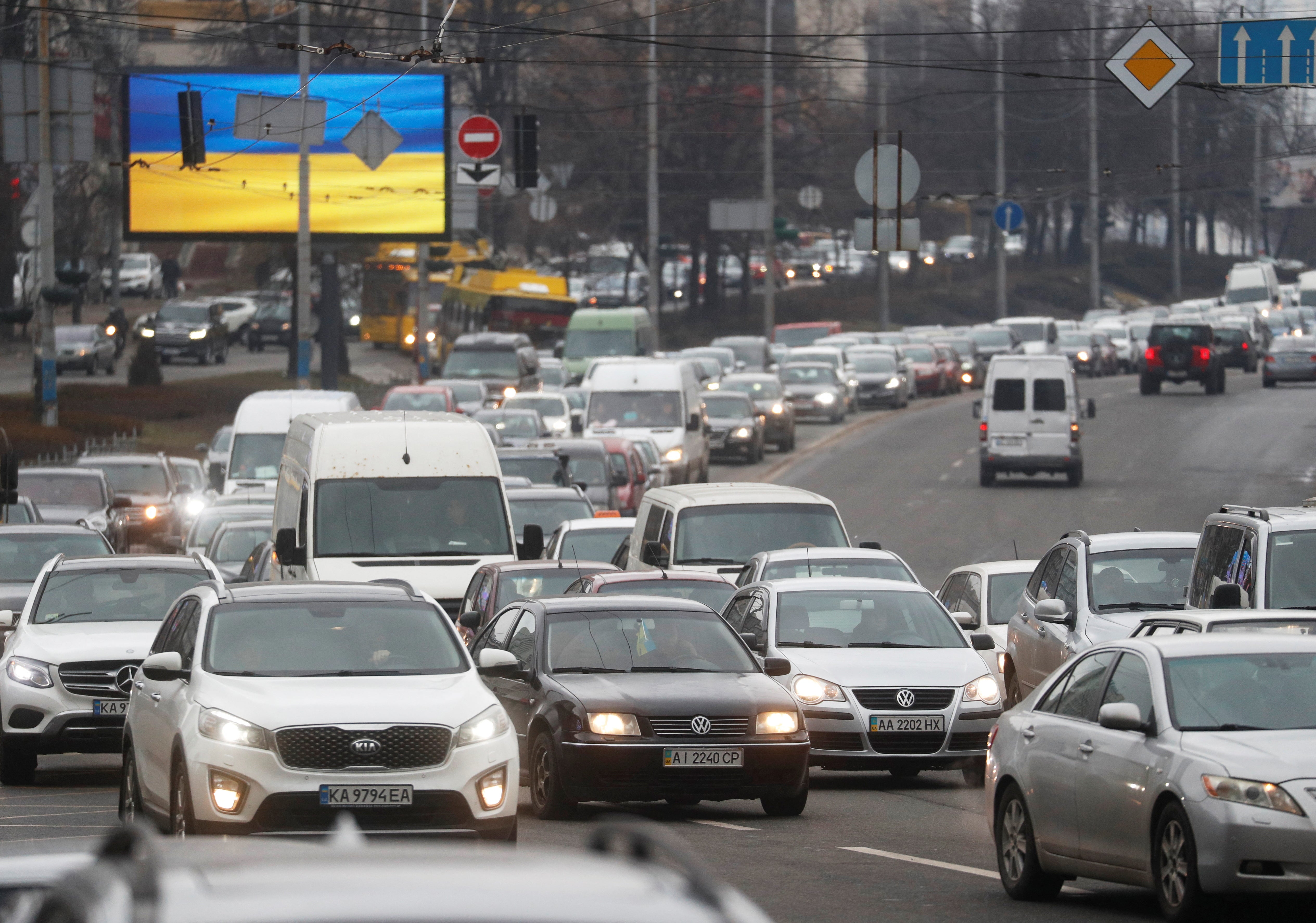 Dozens of cars were seen trying to leave Kyiv on Thursday morning